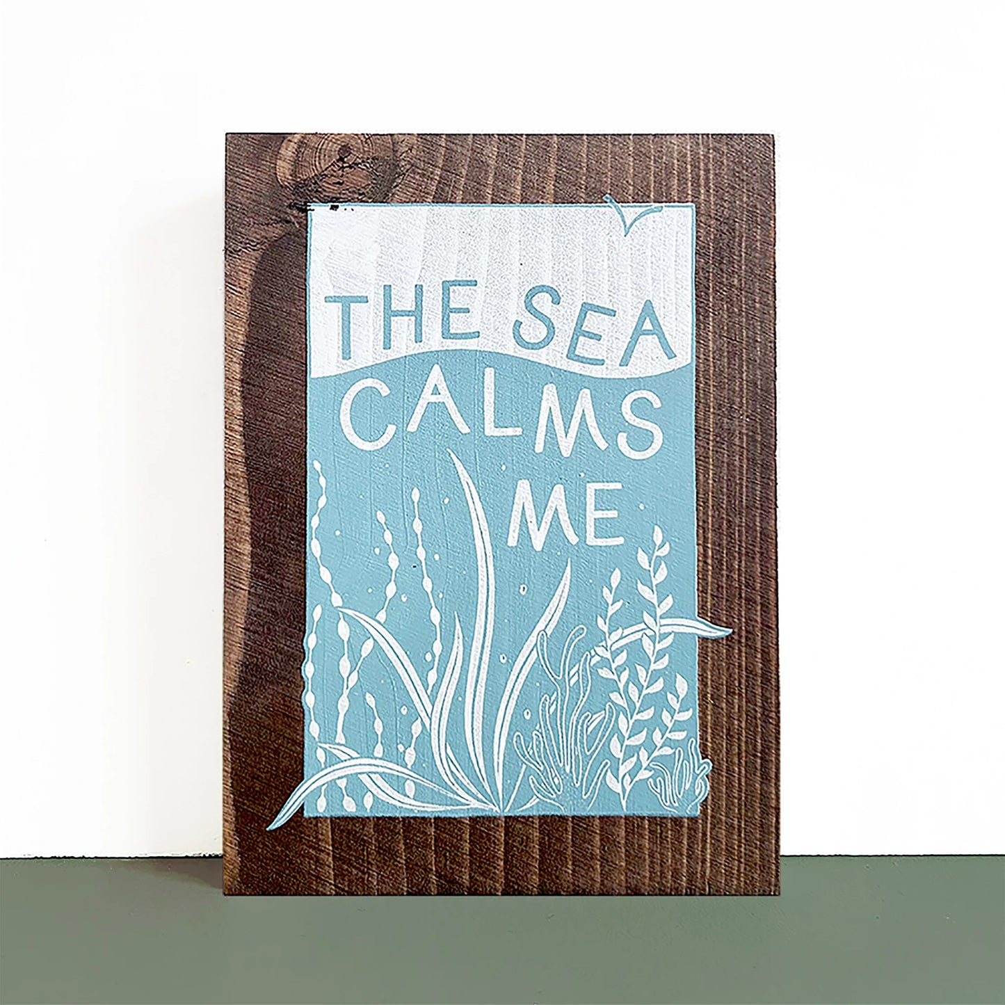 The Sea Calms Me Wooden Print